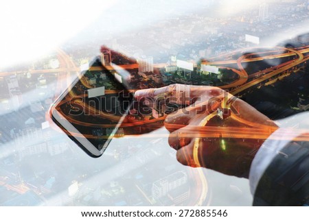 Double exposure of hand touch screen on smartphone.