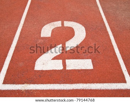 Number two on the start of a running track