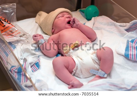 Newborn baby resting in hospital\'s post-delivery room