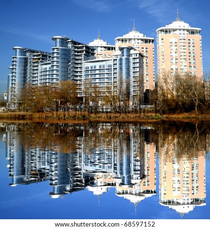 New building with reflection in lake in Kiev, Ukraine