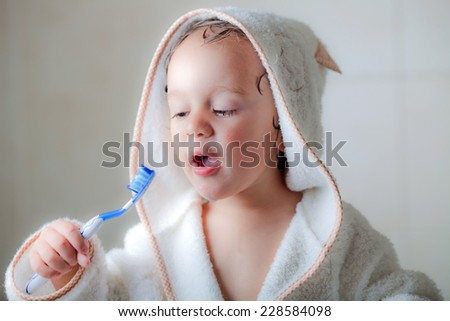 kid wash his teeth