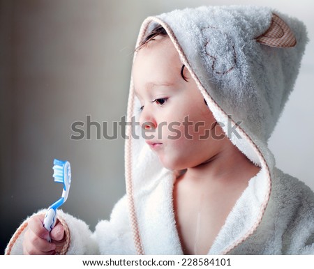 kid wash his teeth
