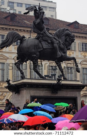 TURIN, ITALY- FEBRUARY 13: demonstration against Berlusconi, politics corruption, for women rights, on February, 13, 2011. During the event there has been a flash mob with umbrellas and balls of wool