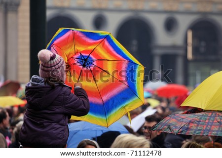 TURIN, ITALY- FEBRUARY 13: demonstration against Berlusconi, politics corruption, for women rights, on February, 13, 2011. During the event there has been a flash mob with umbrellas and balls of wool