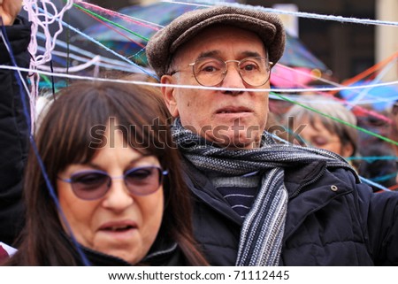 TURIN, ITALY - FEBRUARY 13: demonstration against Berlusconi, politics corruption, for women rights, on February, 13, 2011. During the event there has been a flash mob with umbrellas and balls of wool