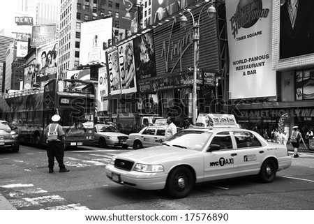 NEW YORK - JUNE 8: A NYC traffic officer directs traffic in this image taken in New York City's Times Square area on June 8, 2008