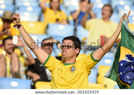 RIO DE JANEIRO, BRAZIL - June 28, 2014: Soccer fans celebrating at the 2014 World Cup Round of 16 game between Colombia and Uruguay at Maracana Stadium.