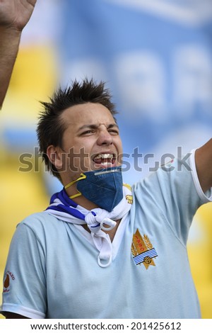 RIO DE JANEIRO, BRAZIL - June 28, 2014: Uruguay soccer fans celebrating at the 2014 World Cup Round of 16 game between Colombia and Uruguay at Maracana Stadium.