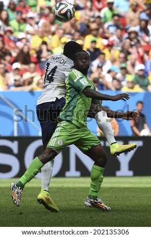 BRASILIA, BRAZIL - June 30, 2014: A team member from  France and a team member from Nigeria compete for the ball during the World Cup Round of 16 game between France and Nigeria at Mane Garrincha Stadium