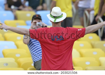 RIO DE JANEIRO, BRAZIL - July 04, 2014: Soccer fans celebrating at the 2014 World Cup round of 8 game between France and Germany at Maracana Stadium.