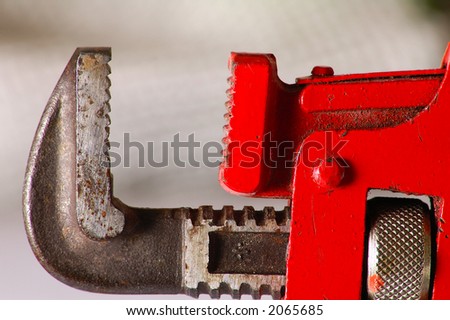plumber tool in  background, detail