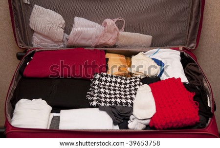 Open luggage with clothes inside