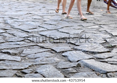Famous street of rock, in Buzios, some people walking