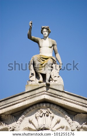 Statue of the Greek god Apollo on the pediment of Oxford\'s Ashmoleon Museum.