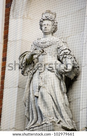 Public statue of Queen Anne (1665 - 1714) erected in 1707 on the outside wall of the Town Hall in Windsor, Berkshire.  Public monument, on display for hundreds of years.