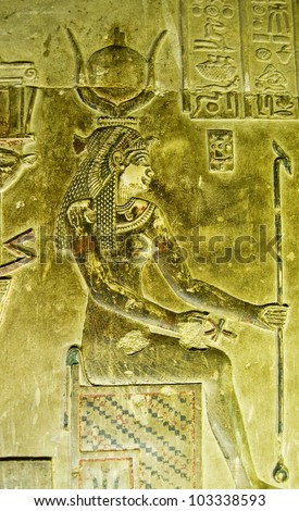 Alabaster bas relief of a woman sitting on an ancient Egyptian throne.  Reputed to be Cleopatra wearing the crown of Hathor.  Crypt of Dendera Temple, near Qena, Egypt.