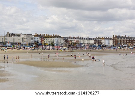 WEYMOUTH, DORSET, ENGLAND - SEPTEMBER 31: Holiday makers enjoying the last of the Summer sunshine at Weymouth on August 31 2012.  The resort has hosted Olympic sailing events.
