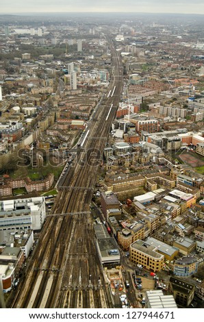 View from above of trains and railway tracks heading into London Bridge Station in South London.  View includes the London boroughs of Bermondsey, Southwark, Millwall and Rotherhithe.