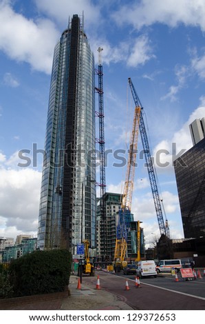 LONDON, UNITED KINGDOM - FEBRUARY 5: police and builders work after the helicopter crash at St George\'s Wharf Tower, Vauxhall on February 5 2013, London.  Two people were killed in the incident.