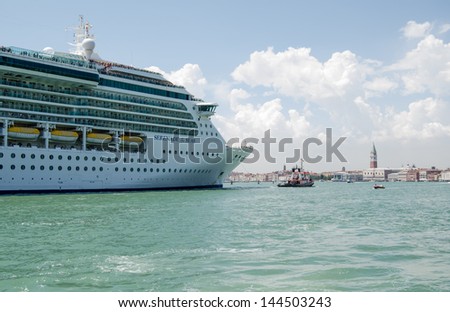 VENICE, ITALY - JUNE 6: The large cruise ship Serenade of the Seas sailing into Venice on June 6 2013.  There have been many protests in the city against such large vessels.