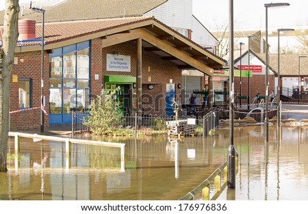 BASINGSTOKE, ENGLAND - FEBRUARY 16 2014: The Ridgeway Community Centre surrounded by flood waters in Basingstoke where many residents have been forced to evacuate their homes.