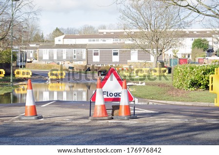 BASINGSTOKE, ENGLAND - FEBRUARY 16 2014: A road closed by flood waters in Basingstoke, Hampshire where many residents have been evacuated from their homes.