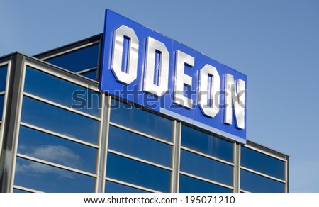 BASINGSTOKE, ENGLAND - JANUARY 19, 2014: Sign at the top of the Odeon cinema multiplex at West Ham Leisure Park, Basingstoke.  The cinema is a popular leisure destination.
