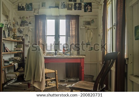 LAUGHARNE, UK - May 5, 2014: Inside the wooden shed occupied by the great Welsh writer Dylan Thomas while writing his plays and poems overlooking the River Taf estuary in Laugharne, Carmarthenshire.
