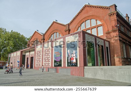 LONDON, UNITED KINGDOM - AUGUST 28, 2014: Families visiting the Museum of Childhood in Bethnal Green, London.  The museum, dedicated to toys and is part of the Victoria and Albert Museum.