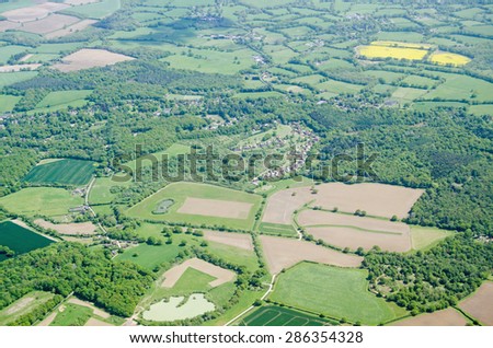 View from above of farmland in the Surrey Hills at the villages of Parkgate and Newdigate near Dorking.
