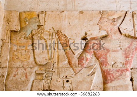 Ancient Egyptian God Ptah with Seti An Ancient Egyptian decorated hieroglyphic carving of the god Ptah with the Pharaoh Seti.  Temple to Osiris at Abydos, Egypt.