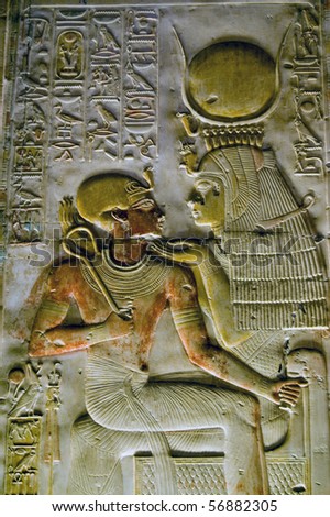 Ancient Egyptian goddess Isis with Pharaoh Seti  Wall of the Temple of Abydos in Egypt.