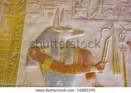 Ancient Egyptian god Anubis   Depicted with the head of a jackal, Anubis is the god of mummification.  Temple to Osiris at Abydos, Egypt.