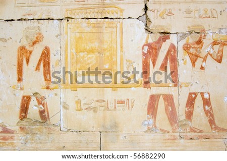 Ancient Egyptian Priests with golden ark An ancient egyptian wall painting showing priests carrying a golden ark.  Wall of the Temple of Ramses II at Abydos, Egypt.