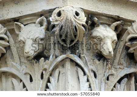 Wolf head capital A pair of wolves\' heads, surrounded by acanthus leaves carved on the top of a stone capital outside Bristol\'s City Museum and Art Gallery.