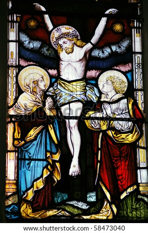 Crucifixion The Crucifixion of Christ depicted in a Victorian stained glass window over 100 years old.  On public display in Saint Mary Magdalene and Saint Denys Church, Midhurst, West Sussex.