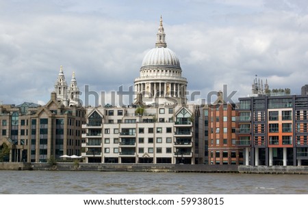 St Paul\'s Cathedral from the River Thames View from a boat on the River Thames in London, of St Paul\'s Cathedral behind rows of apartments and offices in the City of London.