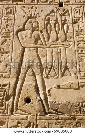Stone carving of the Ancient Egyptian god of the River Nile Hapi.  Shown wearing a crown of lotus flowers.  Wall of the Temple of Seti I, West Bank of the Nile, Luxor, Egypt.