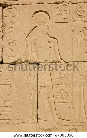Stone carving of the Ancient Egyptian god Horus on a wall of the Temple of Pharoah Seti I on the West Bank of the River Nile at Luxor, Egypt.
