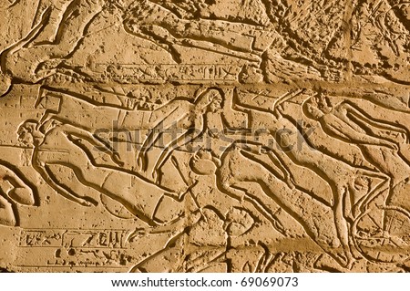 Dead and dying soldiers on the battlefield of Kadesh.  Ancient Egyptian stone carved frieze on the second pylon of the Ramesseum, Luxor, Egypt,.