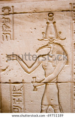 Ancient Egyptian hieroglyphic carving of the ibis headed god of knowledge Thoth.  Outer wall of the Temple of Horus, Edfu, Egypt.