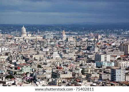 View across Central and Old Havana, Cuba. As well as many apartments and office buildings, the view includes the dome of the Capitolio building and the turret on the city\'s main telephone exchange.