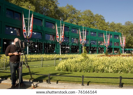 LONDON, UK -APRIL 27: Members of the media broadcast, in preparation of the Royal Wedding, from television studios built for international media on April 27, 2011 outside Buckingham Palace, London, UK.