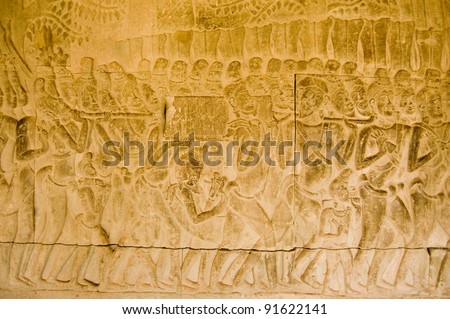 Bas relief carving of a procession carrying an ark with religious significance.  Inner wall at Angkor Wat Temple, Siem Reap, Cambodia.
