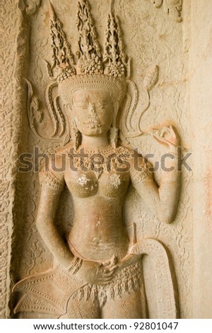Sculpture of an Apsara dancing goddess.  Interior column at Angkor Wat temple, Siem Reap, Cambodia.
