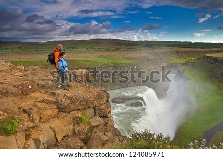 Hiking in Iceland (Island), Gullfoss waterfall - beautiful wild landscape of big waterfalls, green mountains, glaciers and volcanoes