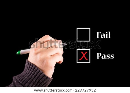 business hand writing red check mark for pass selection