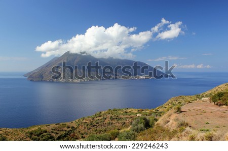 The island of Salina in the Aeolian Islands with cloud on the top of the volcano
