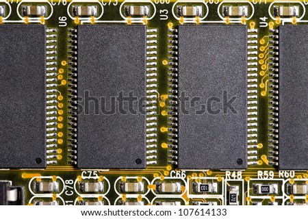 Close-up of four computer chips. electronic circuit board