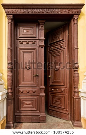 Old  half-opened wooden door in church